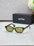 Dark olive oval sunglasses with green lenses and gold-toned temple detail