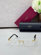 Clear rectangular eyeglasses with black temples and gold-tone metal bridge detail.
