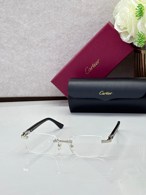 Clear rectangular eyeglasses with black temple tips and silver metal hinge detail.