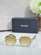 Chanel square sunglasses with light yellow tinted lenses and gold-tone frame