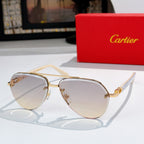 Sunglasses with gold metal frame and pale tinted lenses