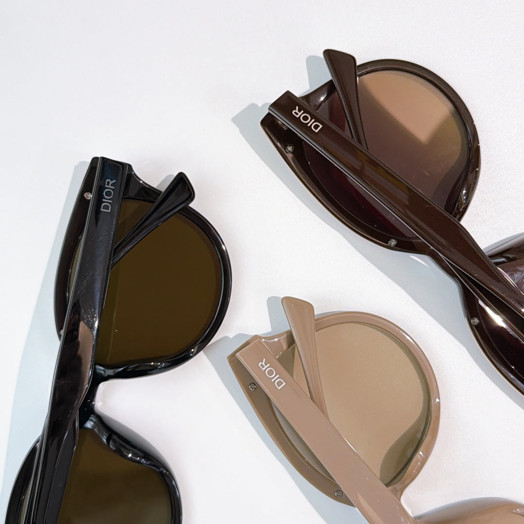 Dior cat-eye sunglasses set with brown, black, and beige frames and tinted lenses