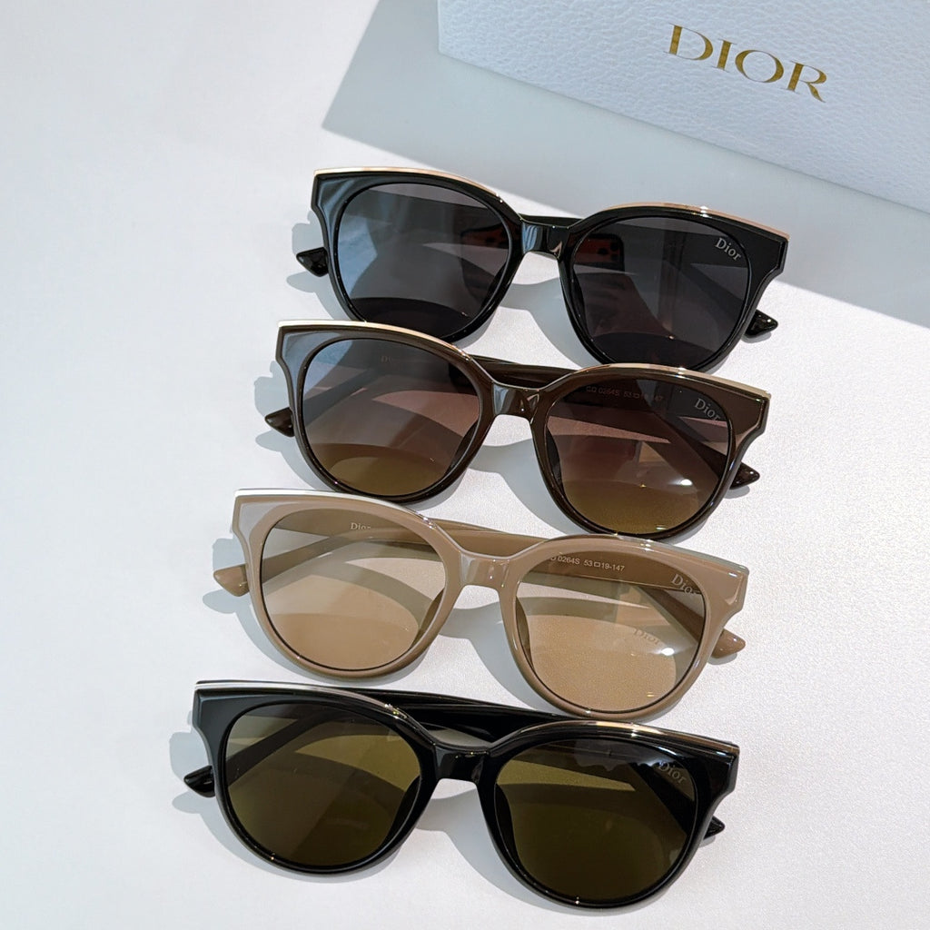 Dior cat-eye sunglasses set with black, brown, beige, and dark lenses