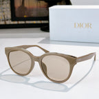 Dior cat-eye sunglasses with light beige frames and clear-to-beige tinted lenses