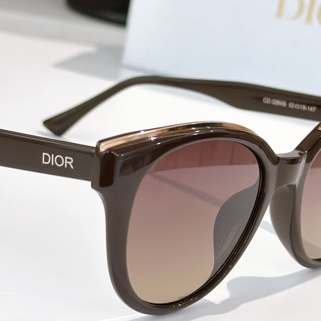Dior cat-eye sunglasses side view with dark frames and rose-brown tinted lenses