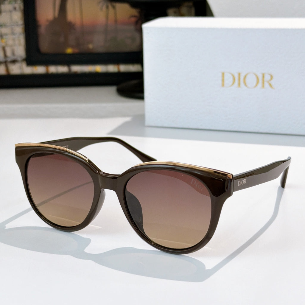 Dior cat-eye sunglasses with dark frames and gradient pink-brown tinted lenses