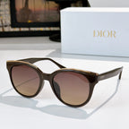 Dior cat-eye sunglasses with dark frames and gradient pink-brown tinted lenses