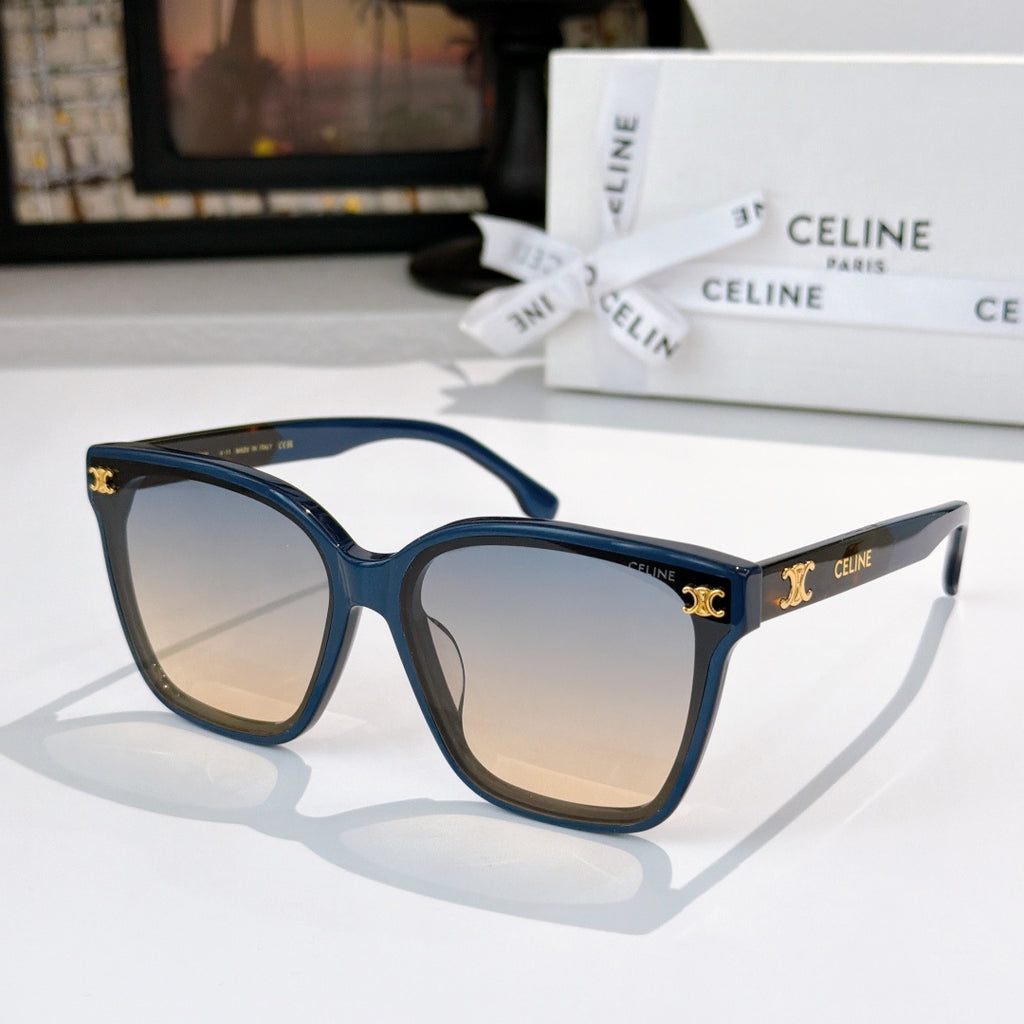 Sunglasses with blue frame and tan tinted lenses, gold logo on temples