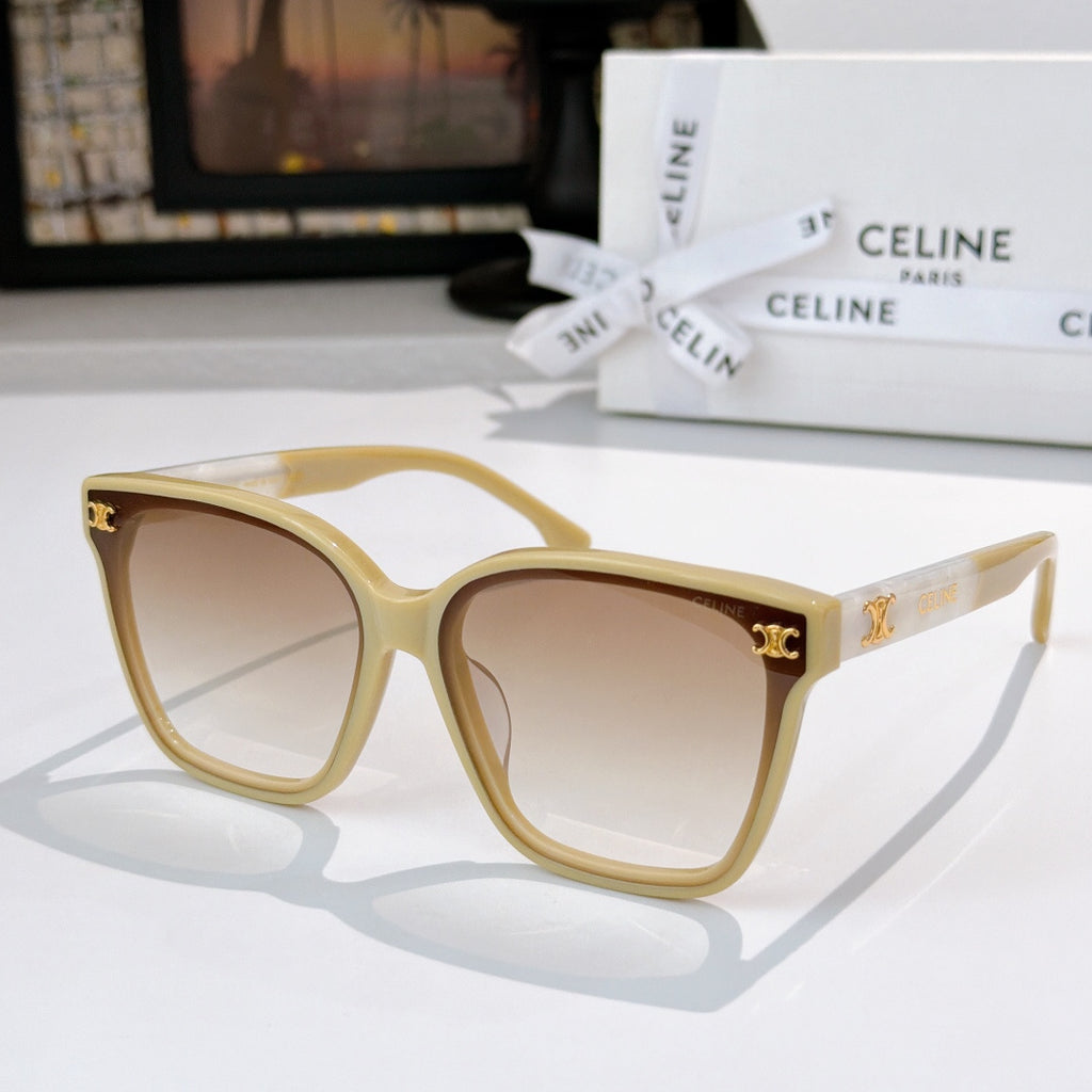 Sunglasses with cream frame and brown tinted lenses, gold logo on temples