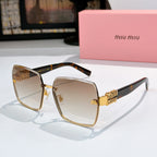 Sunglasses with brown-tinted lenses, tortoise temples, and gold logo embellishments