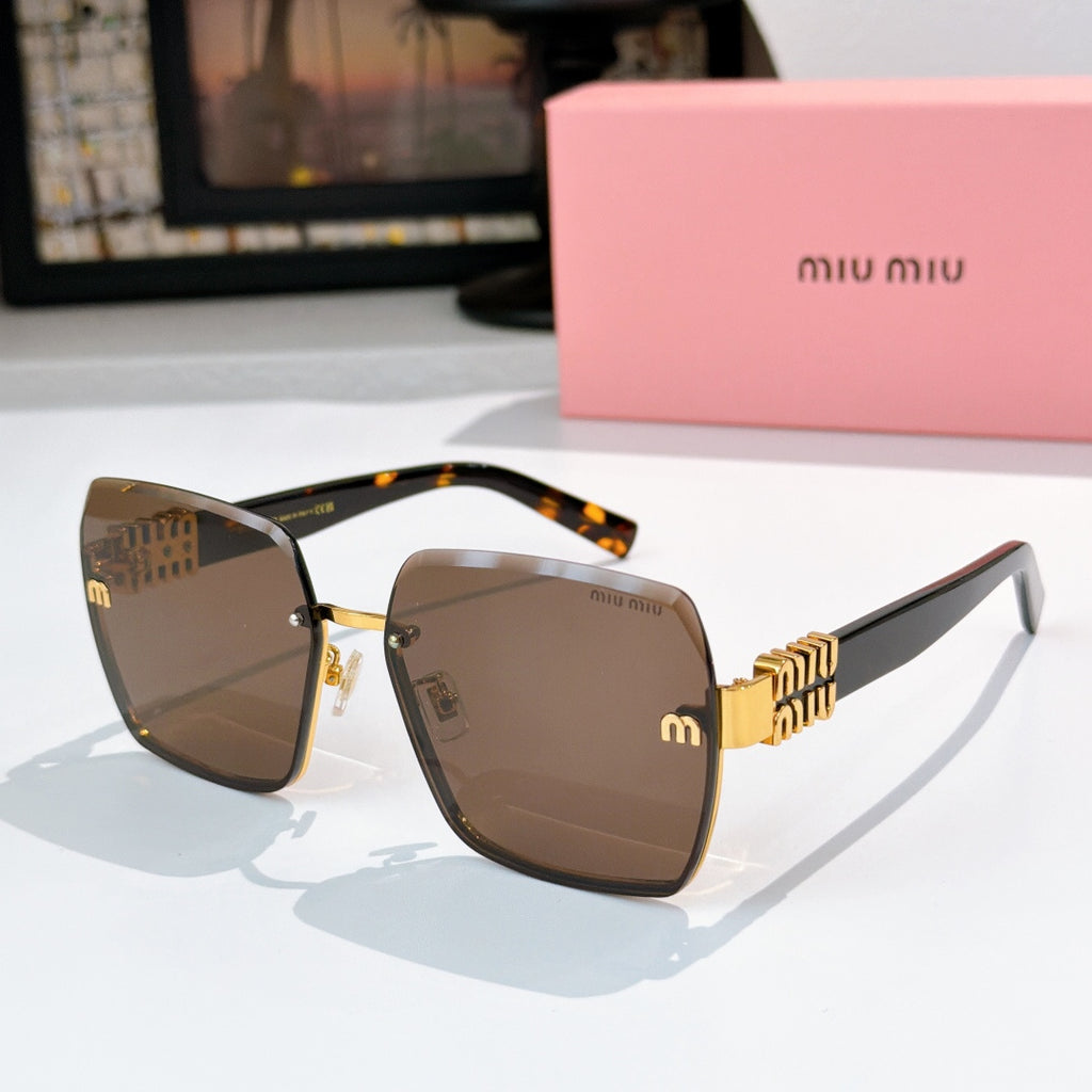 Sunglasses with dark brown lenses, tortoise temples, and gold chain-style hinges