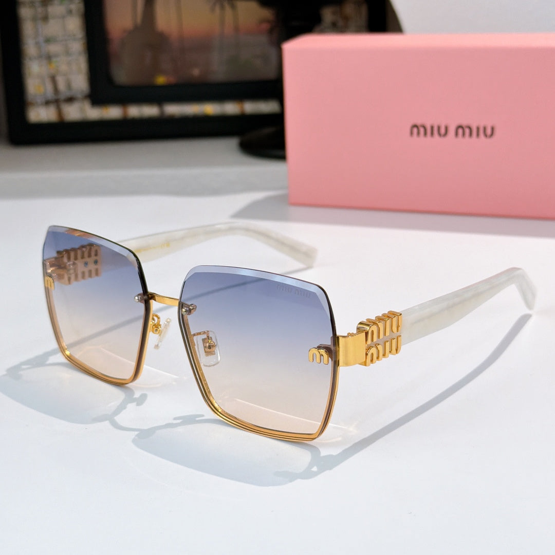 Sunglasses with light blue lenses, gold-toned frame, and tortoise temple arms
