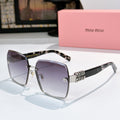 Sunglasses with dark lenses, tortoise temples, and gold logo hardware detail