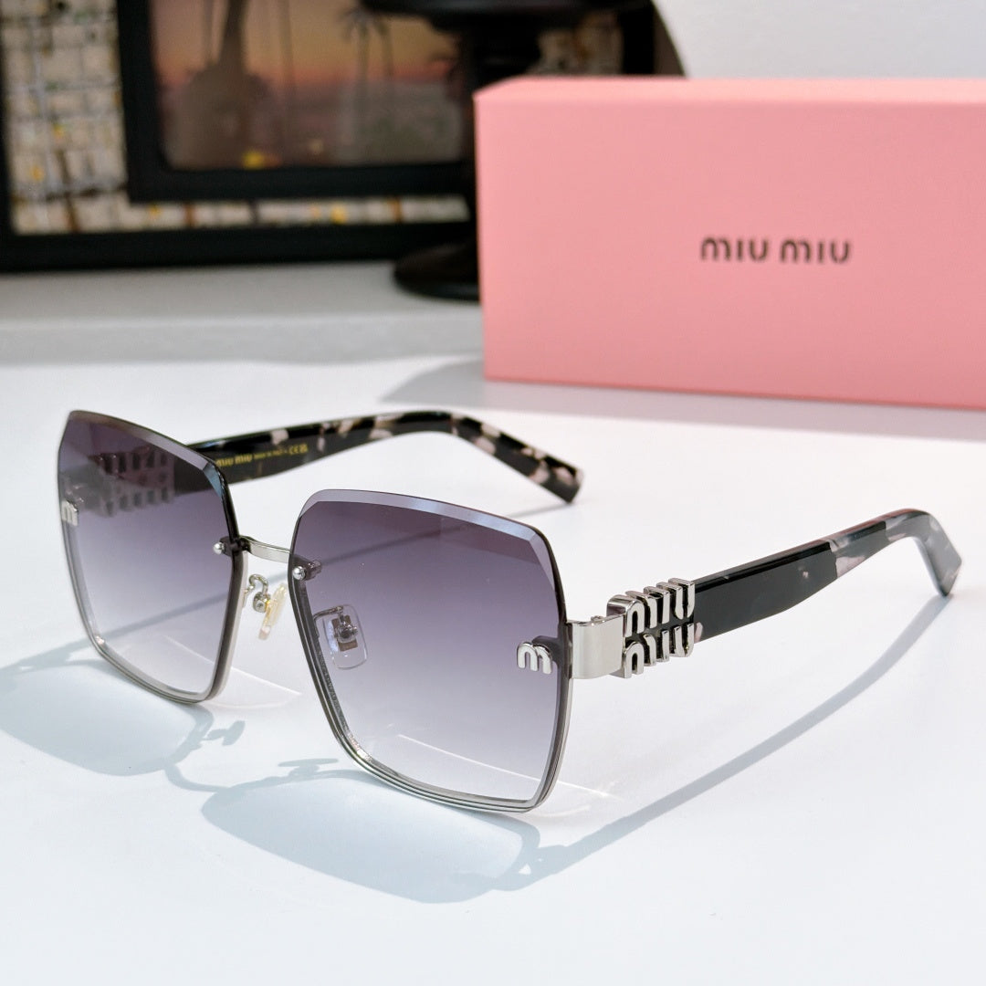Sunglasses with dark lenses, tortoise temples, and gold logo hardware detail