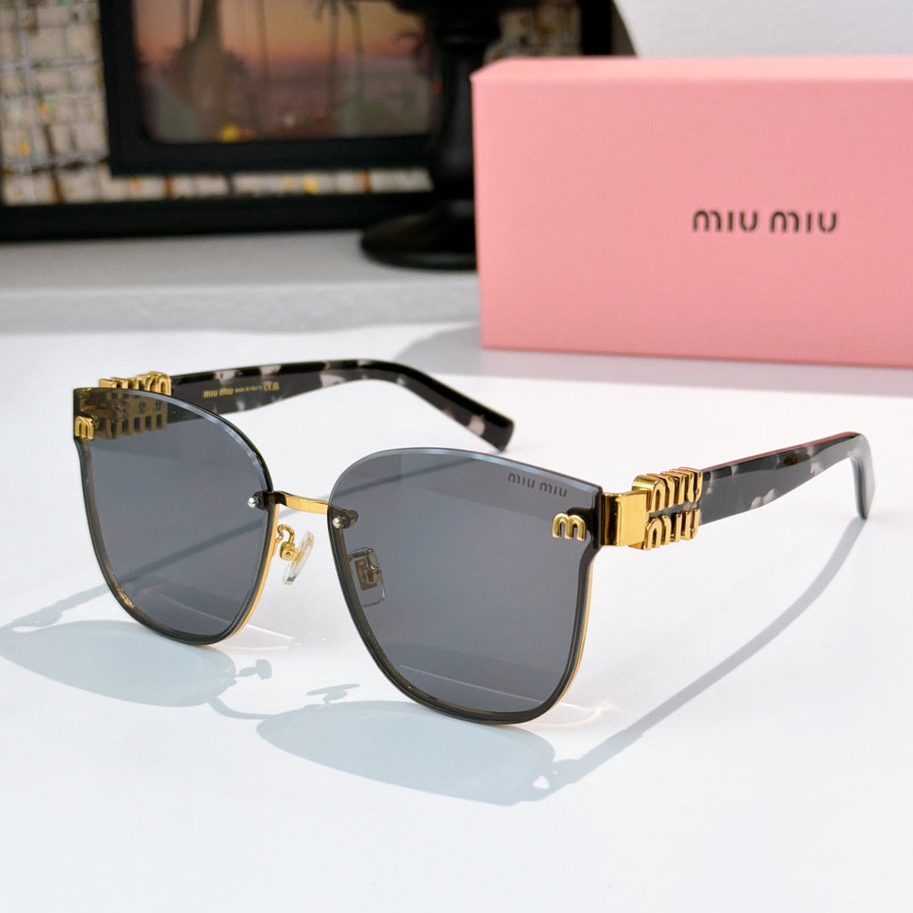 MiuMiu glasses with silver-toned frames and smoke gray lenses