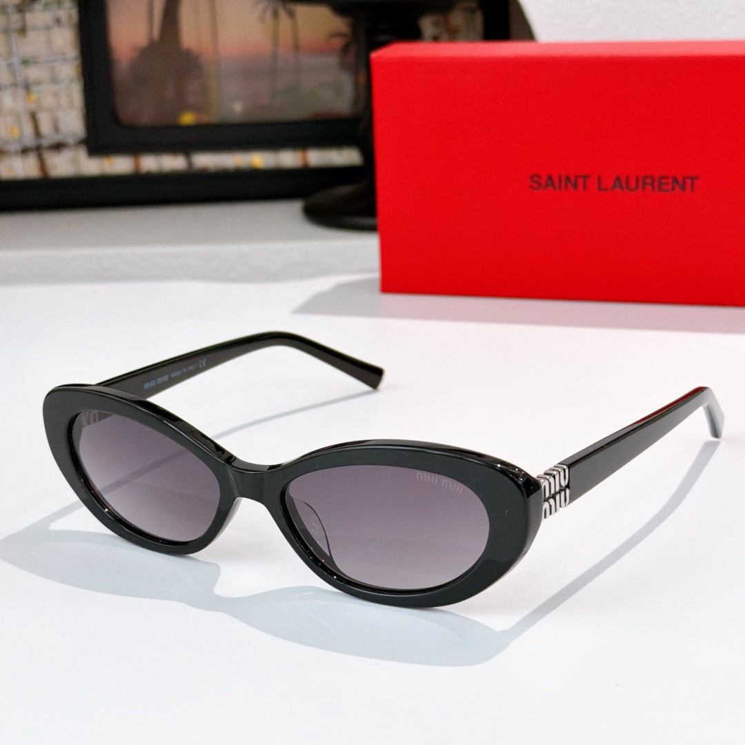 MiuMiu cat-eye sunglasses with dark frame and purple-tinted lenses, gold logo detail