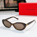 MiuMiu cat-eye sunglasses with tortoiseshell frame and brown lenses, gold logo detail