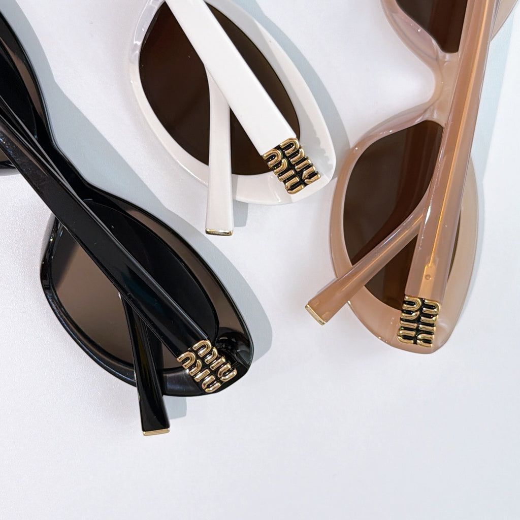 MiuMiu cat-eye sunglasses temple detail, gold logo on black and beige frames