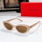 MiuMiu cat-eye sunglasses with light beige frame and brown lenses, gold logo detail