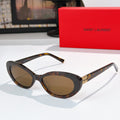 MiuMiu cat-eye sunglasses with tortoiseshell frame and brown lenses, gold logo detail