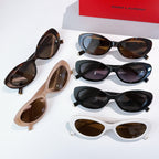 MiuMiu cat-eye sunglasses set with multiple frames: black, brown, white, and beige with lenses