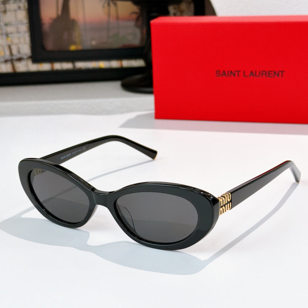 MiuMiu cat-eye sunglasses with black frame and dark lenses, gold logo detail