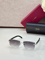 Cartier eyeglasses with black rectangular frames and gray gradient lenses, gold accents