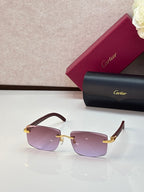 Cartier eyeglasses with dark brown frames and pink-purple gradient lenses, gold accents