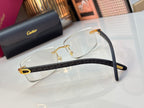Eyeglasses with clear lenses, patterned dark temple bar, and gold-tone hinges