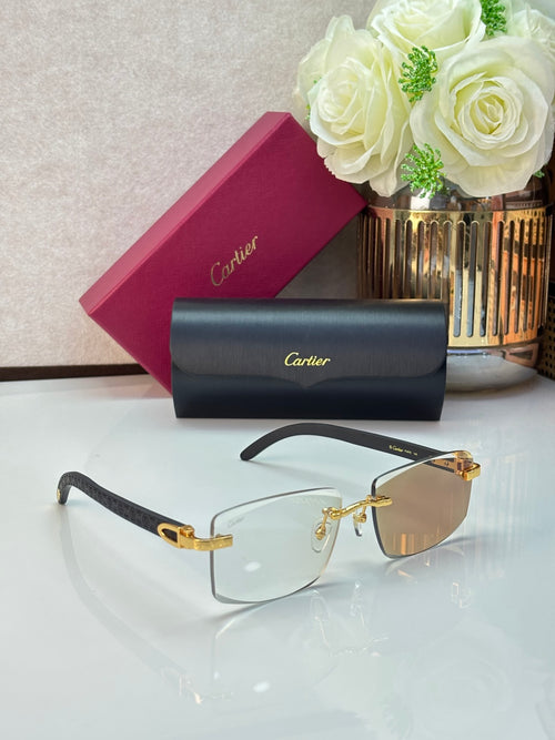 Eyeglasses with dark frames, clear lenses, and gold-tone temples with logo