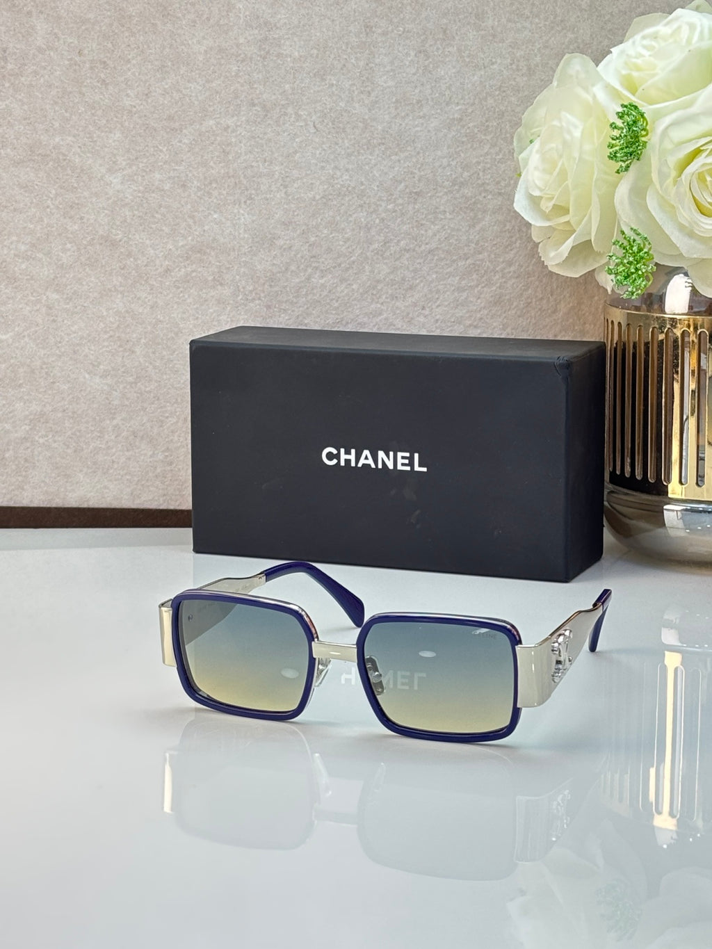 Celine glasses with navy frames and blue-tinted lenses