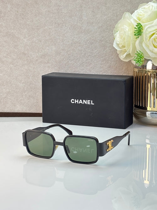 Celine glasses with dark rectangular frames, green-tinted lenses, and gold logo detail