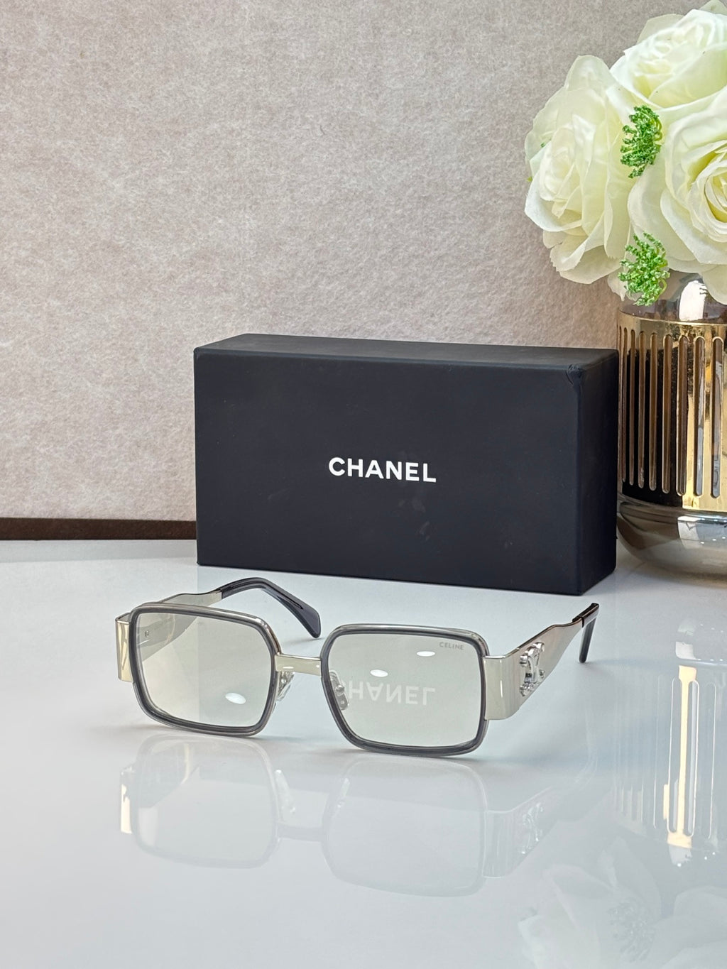 Celine glasses with light gray frames and clear lenses