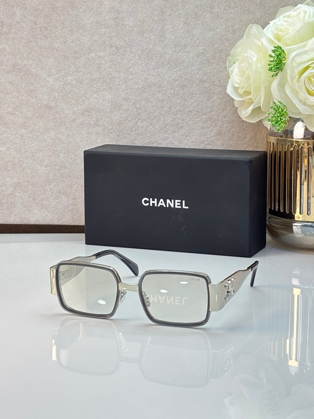 Celine glasses with light gray frames and clear lenses