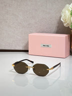 MiuMiu dark-brown round sunglasses with gold arms and tinted lenses
