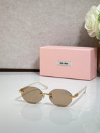 MiuMiu gold-trim round sunglasses with taupe lenses and light frames