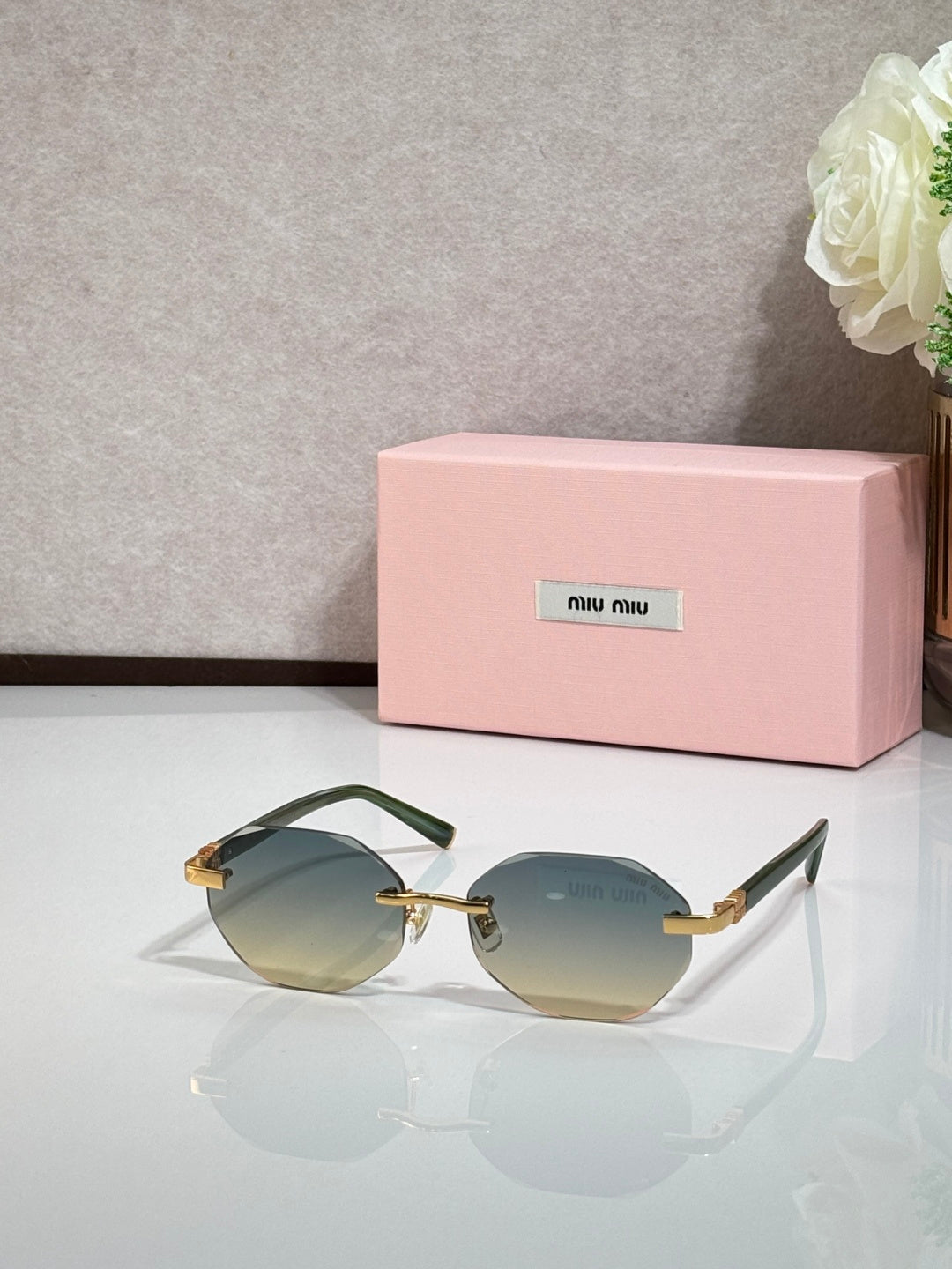 MiuMiu gradient green round sunglasses with gold arms and dark frames