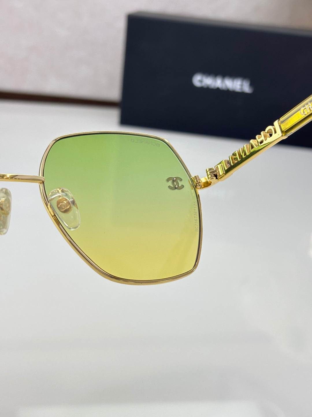 Chanel sunglasses with gold frame and bright lime green tinted lenses