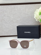 Chanel eyeglasses with light pink square frames and tinted lenses, logo temples