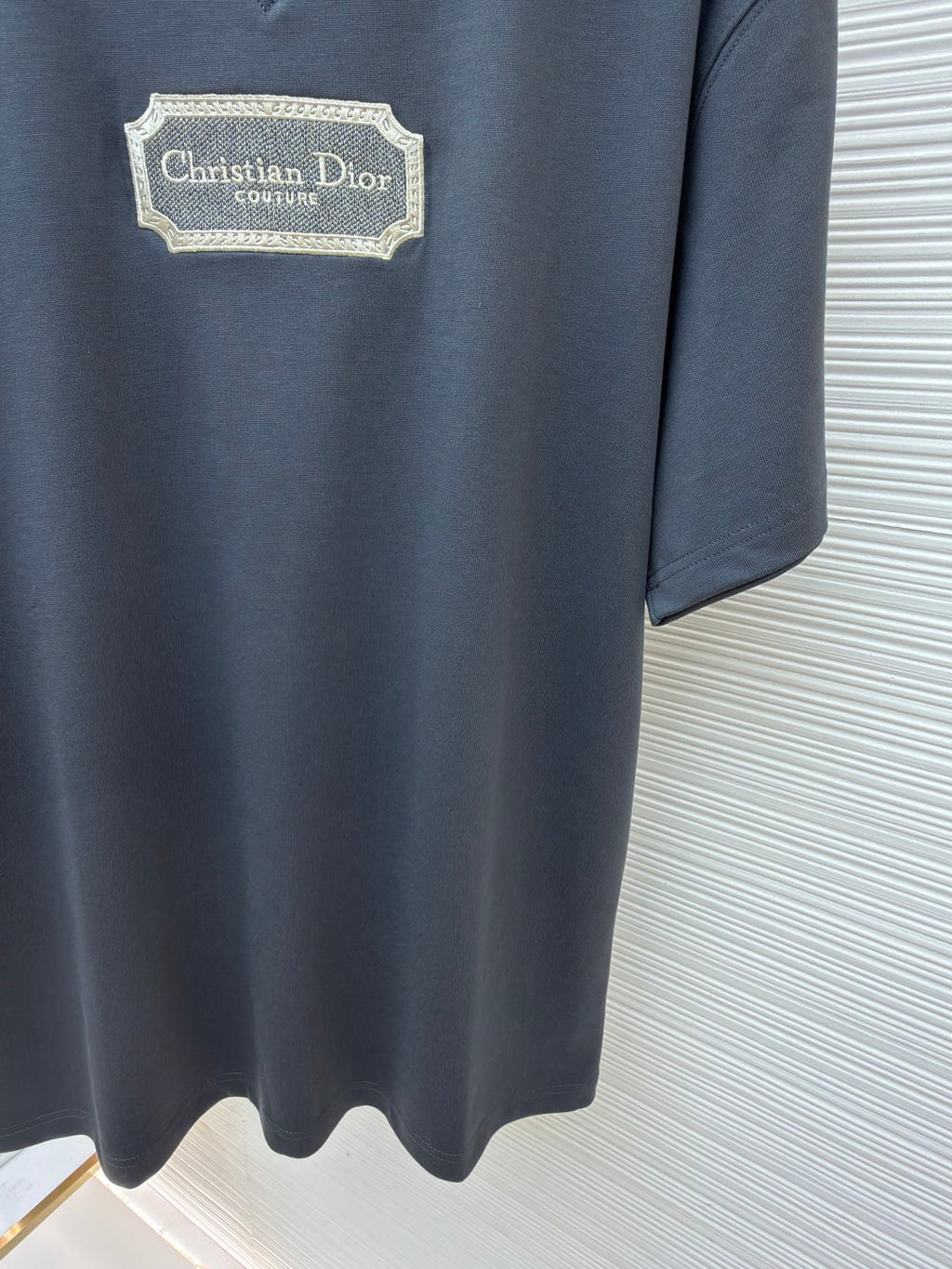 Dior dark blue T-shirt with Christian Dior Couture logo patch and curved hemline