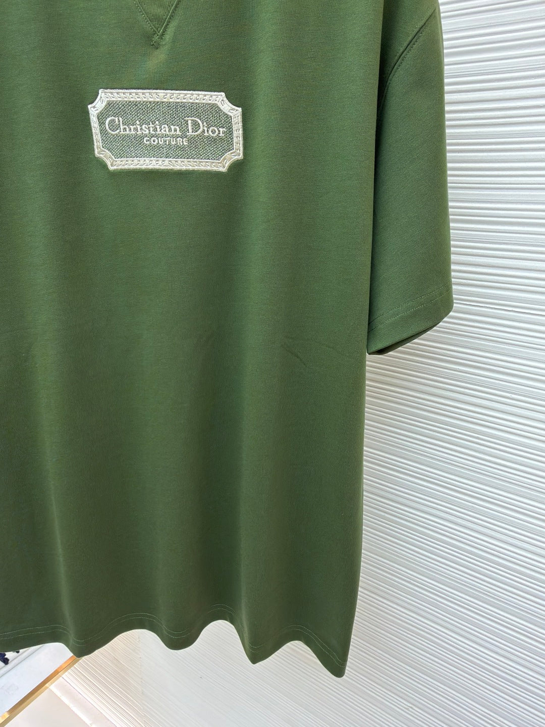 Green T-shirt hem and front logo, Christian Dior Couture