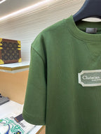 Green T-shirt sleeve and chest, Christian Dior Couture logo