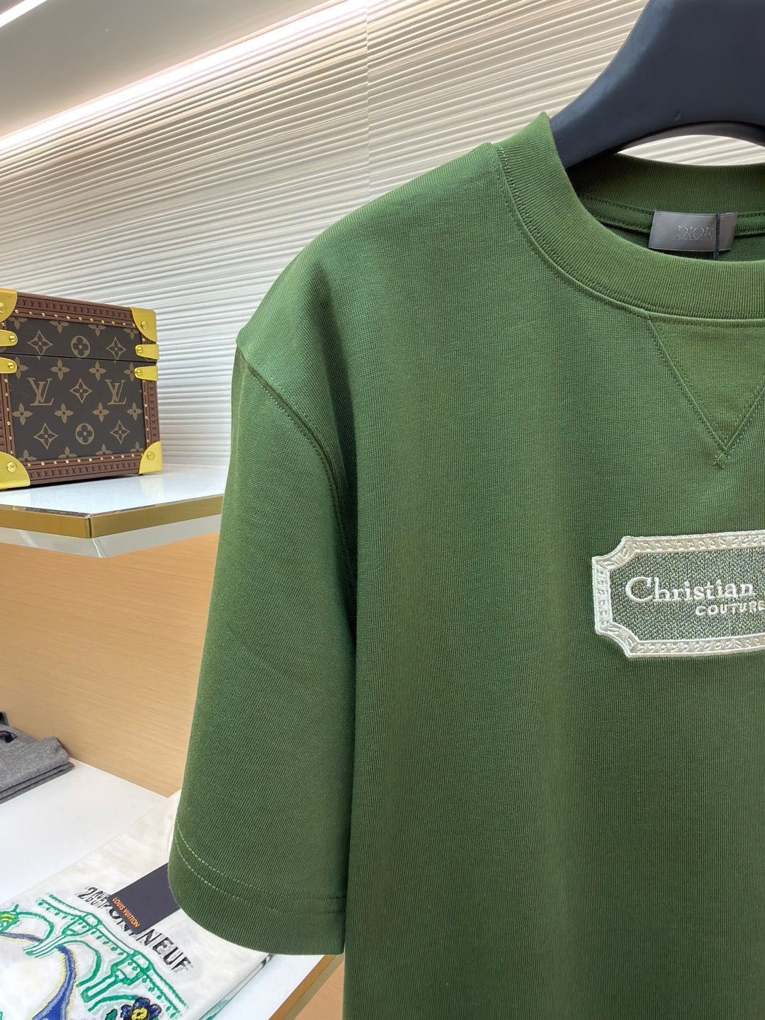 Green T-shirt sleeve and chest, Christian Dior Couture logo