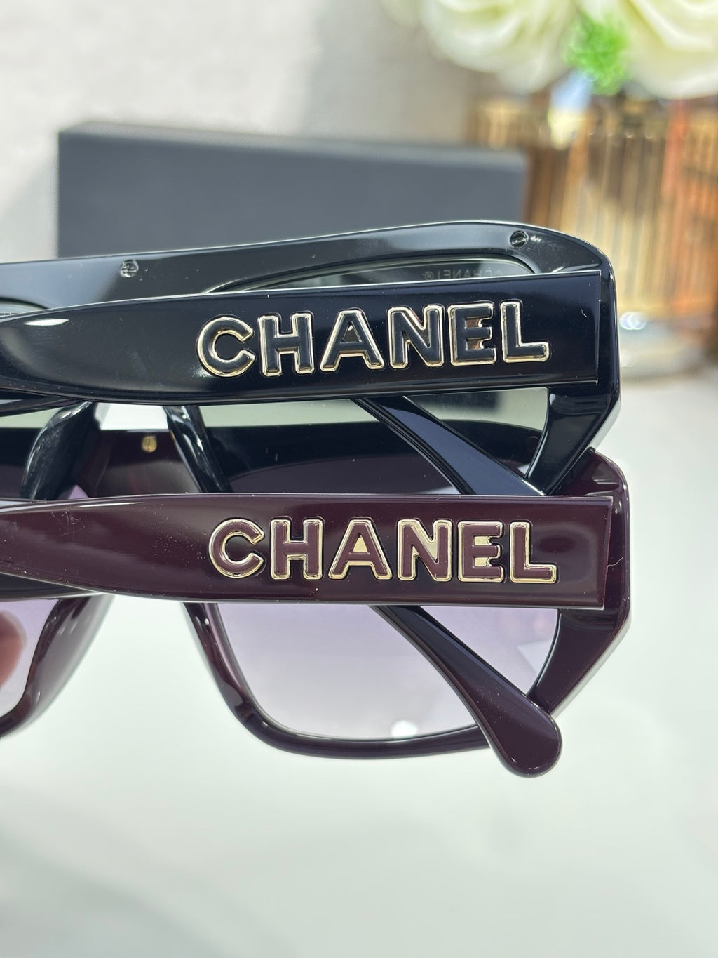 Chanel glasses with CHANEL logo temples, close-up of front frames