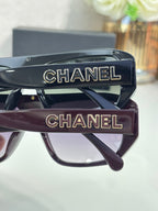 Chanel glasses with CHANEL logo temples, close-up of front frames