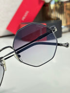 Prada round sunglasses with dark frame and purple gradient lenses