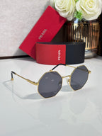 Prada round sunglasses with gold-tone frame and dark lenses