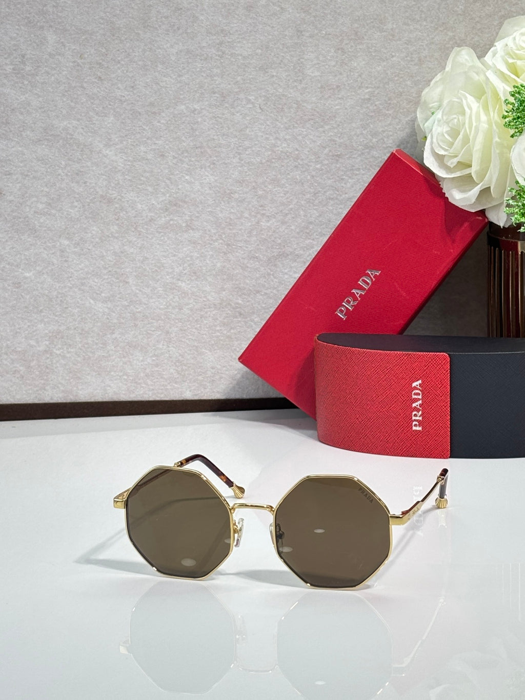 Prada round sunglasses with gold-tone frame and olive-brown lenses