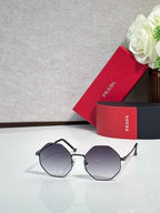 Prada round sunglasses with black frame and dark gray lenses
