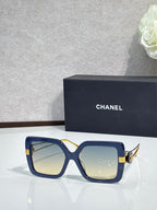 Chanel square sunglasses with navy-blue frames and gold-tone hinges